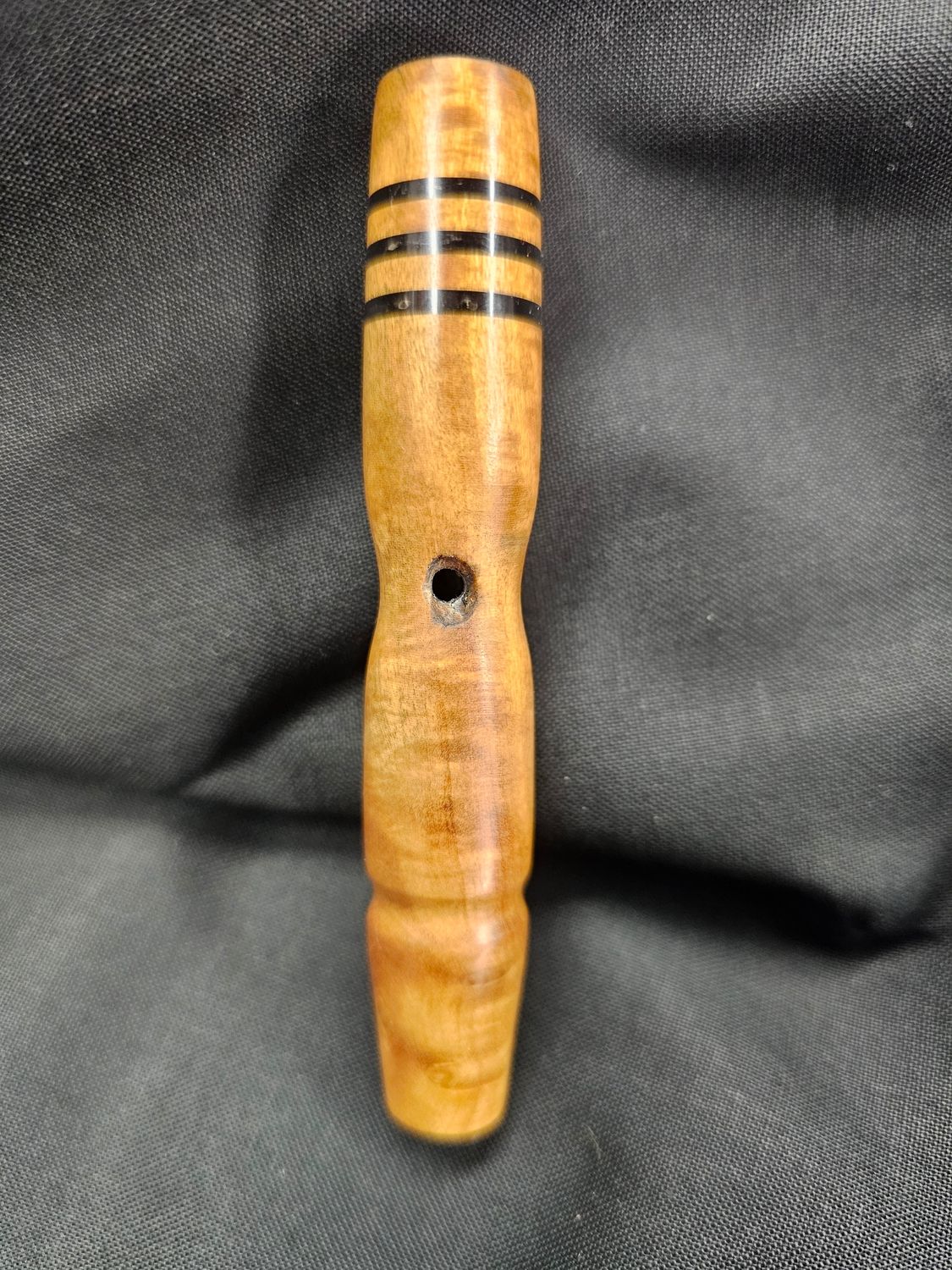 Figured camphor with black inlay and airport