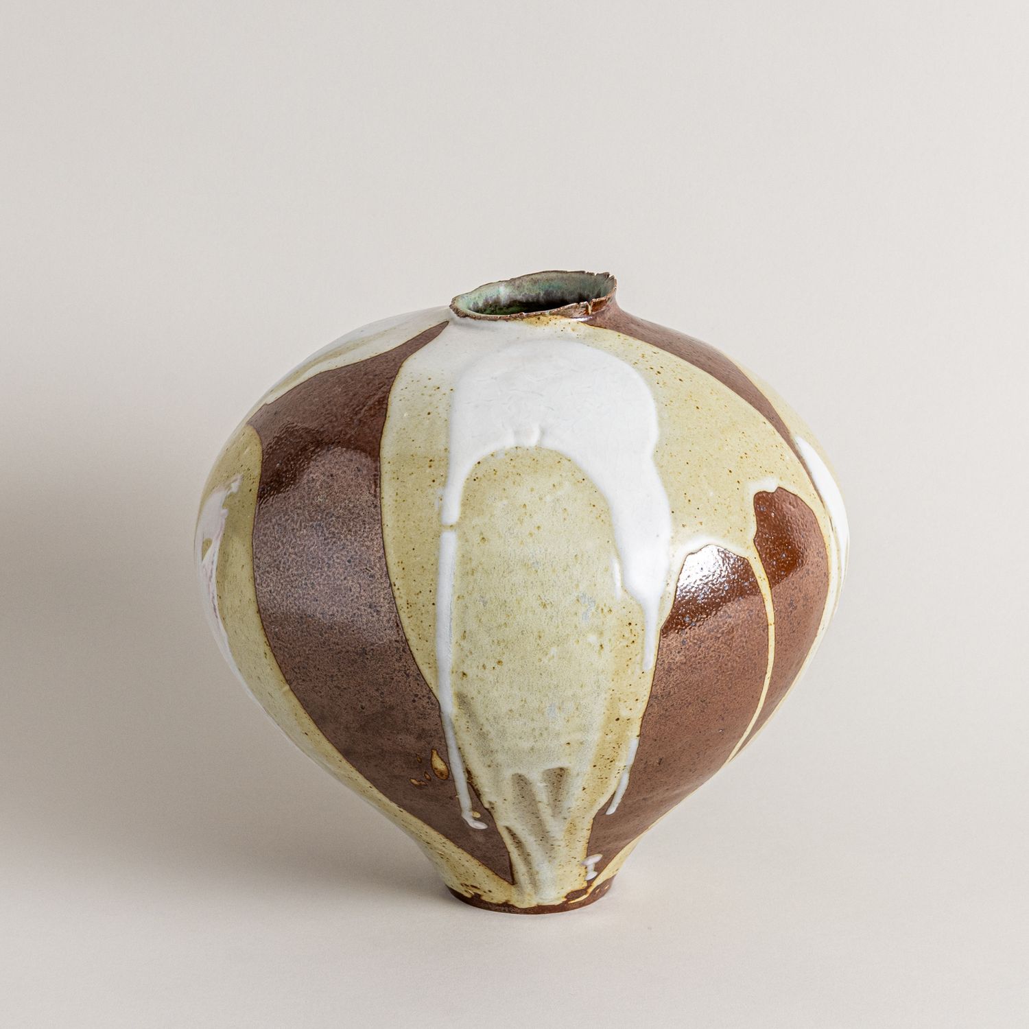 Brown, Cream, and White Vessel