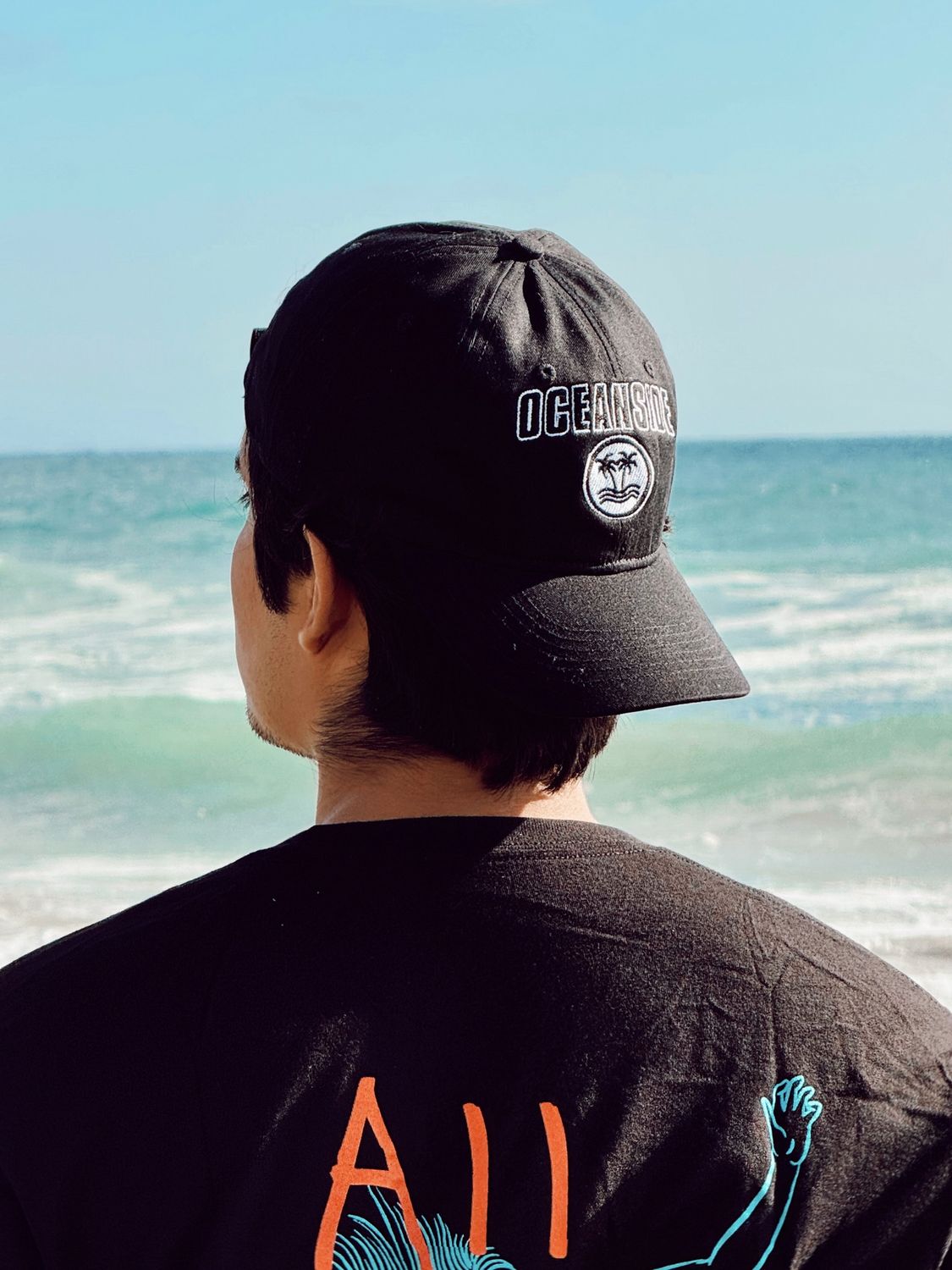 Palms-Wave in Circle Oceanside Black Cap