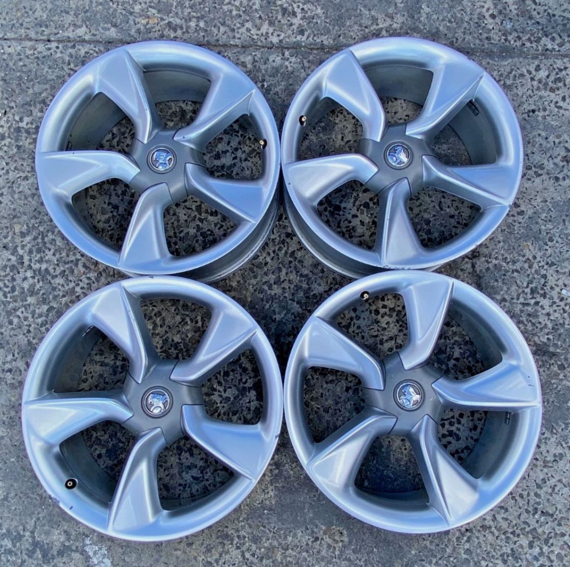 *USED* SET 4 HOLDEN ASTRA 5 SPOKE 19x8" SILVER WHEELS - PCD: 5/115 - ET:36P