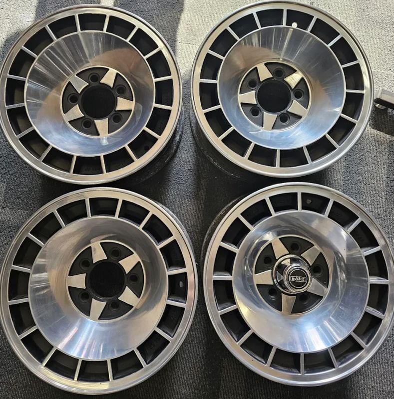 *USED* SET OF 4 MULLIN S CHROME DELTA WHEELS 14x7" PCD: 5x114.3 ET: 0 FORD PRE AU