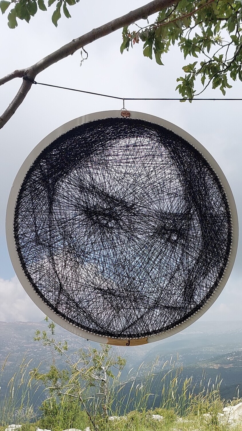Personalized female thread portrait displayed in a natural landscape