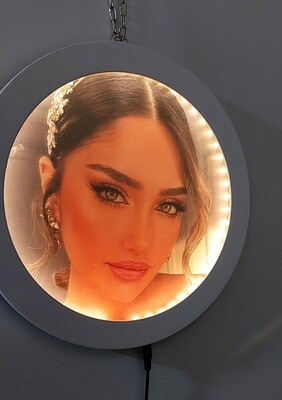 Illuminated FaceLyne Magical Mirror revealing a personalized bridal portrait