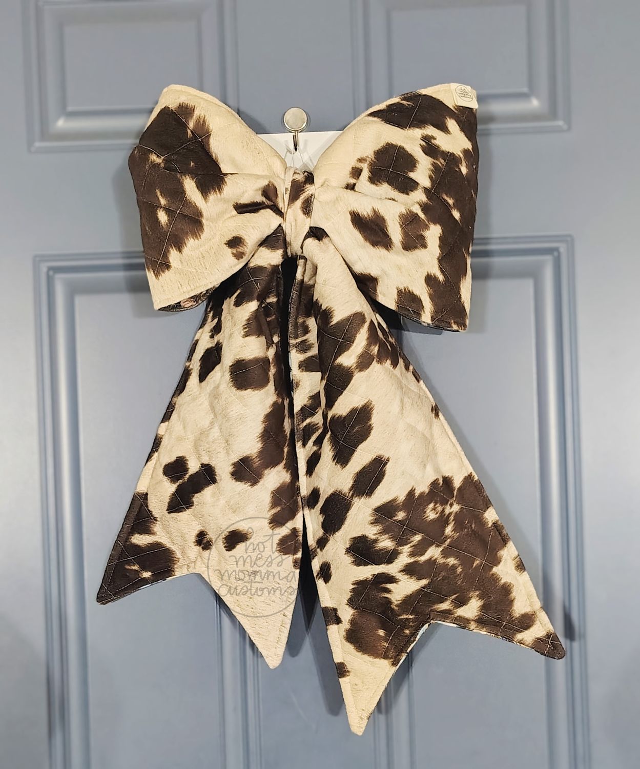 Reversible faux Cow Hide/Cow Faces Door Bow