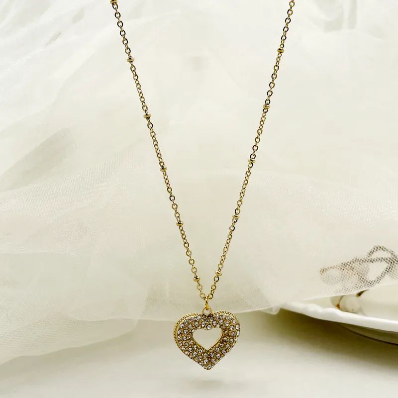 Clear zircon heart gold necklace
