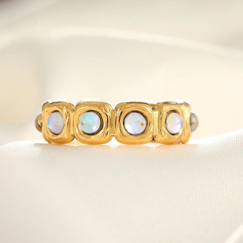 Gold ring with clear zircon