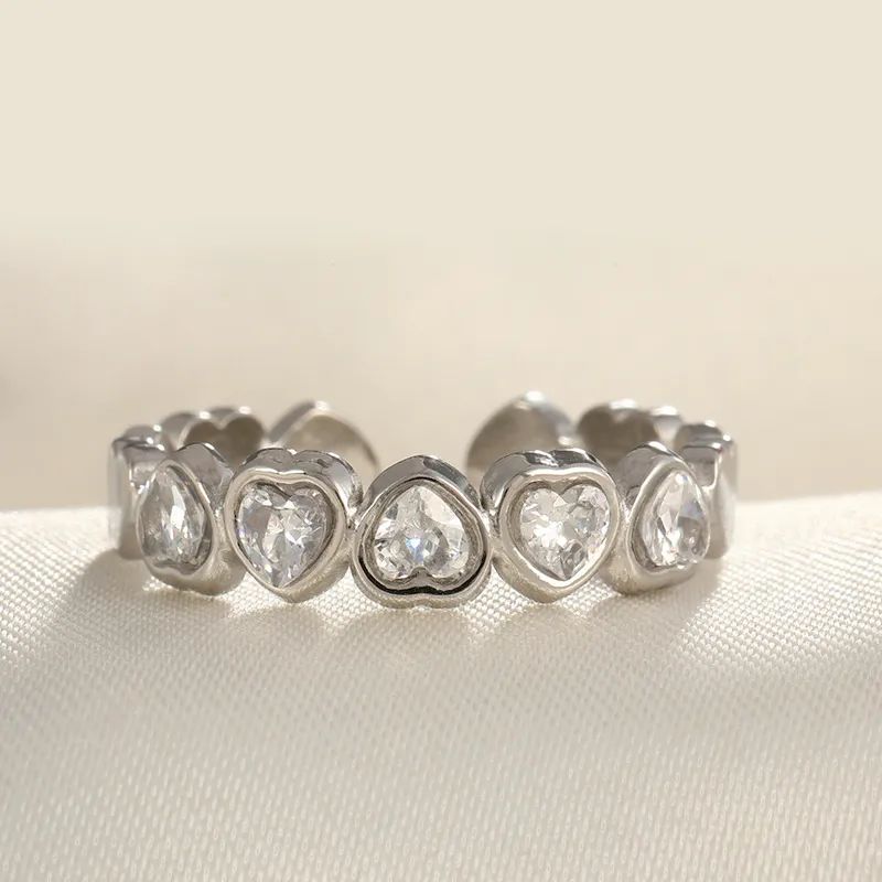 Silver ring with clear zircon hearts