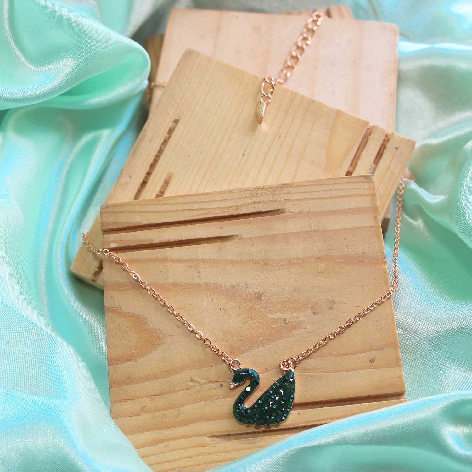 Gold green swan
