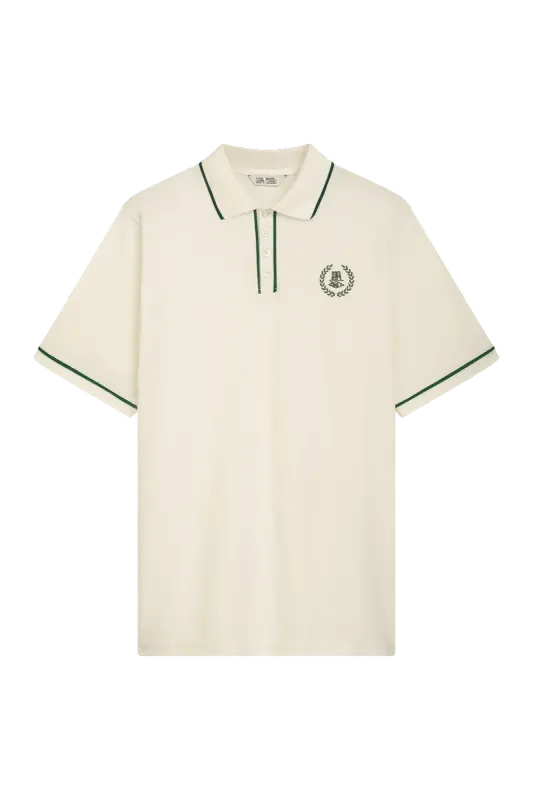 a LOTC LOTC POLOSHIRT WHITE / EVERGREEN UNFAIR ATHLETICS