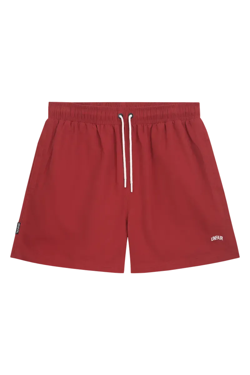 a  BURGUNDY SWIM SHORTS UNFAIR ATHLETICS