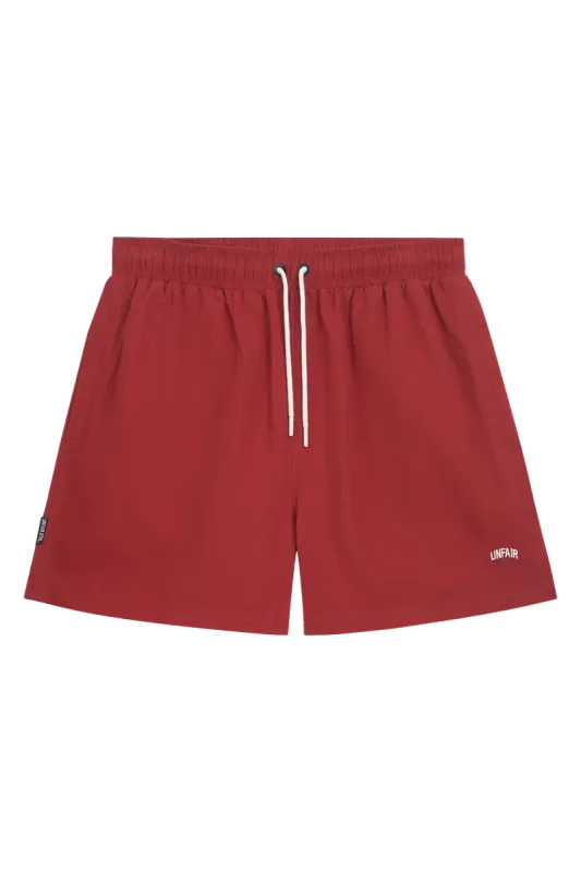 a  BURGUNDY SWIM SHORTS UNFAIR ATHLETICS