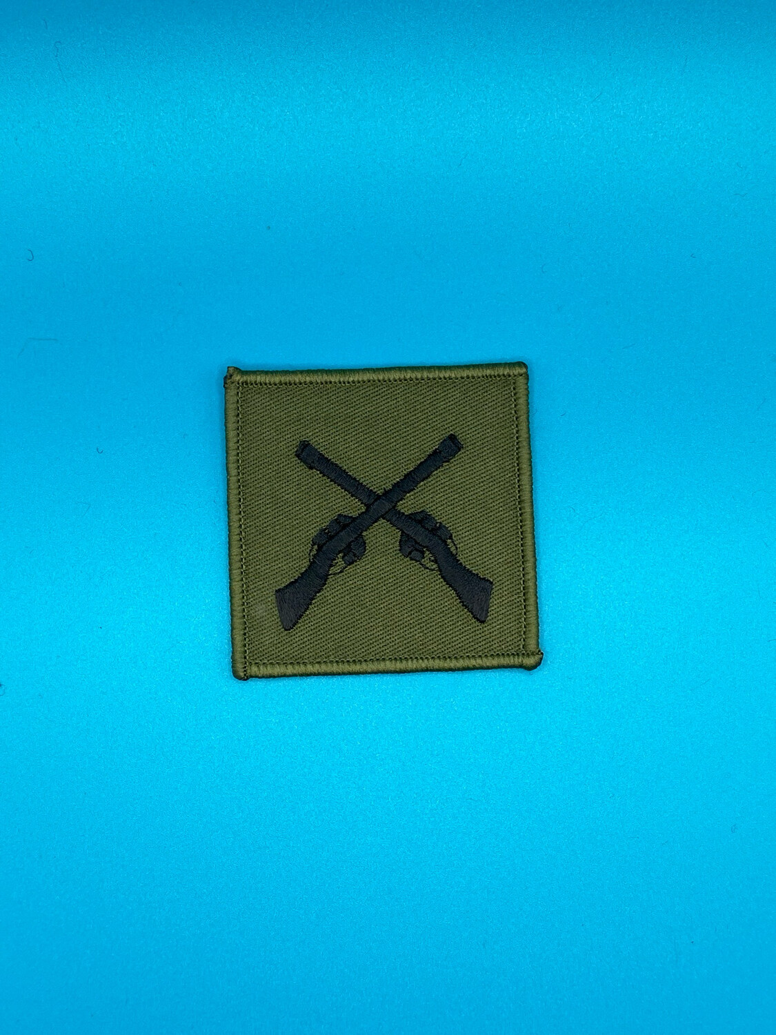 Army Marksman Skill-at-Arms SAA Badge - Black on OG Olive Green