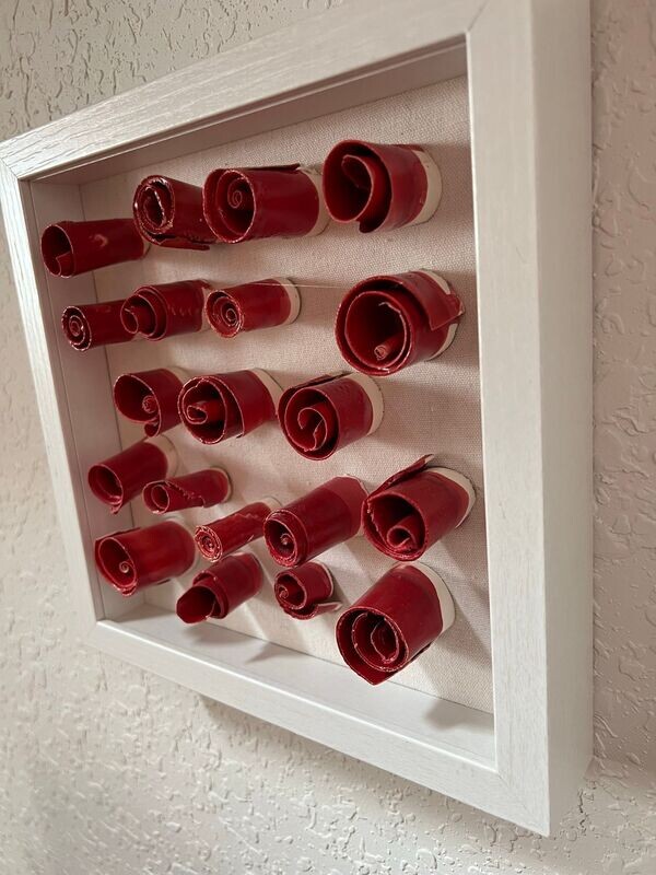 Ceramic Candy like Red Stoneware sculptured in a  Shadow box