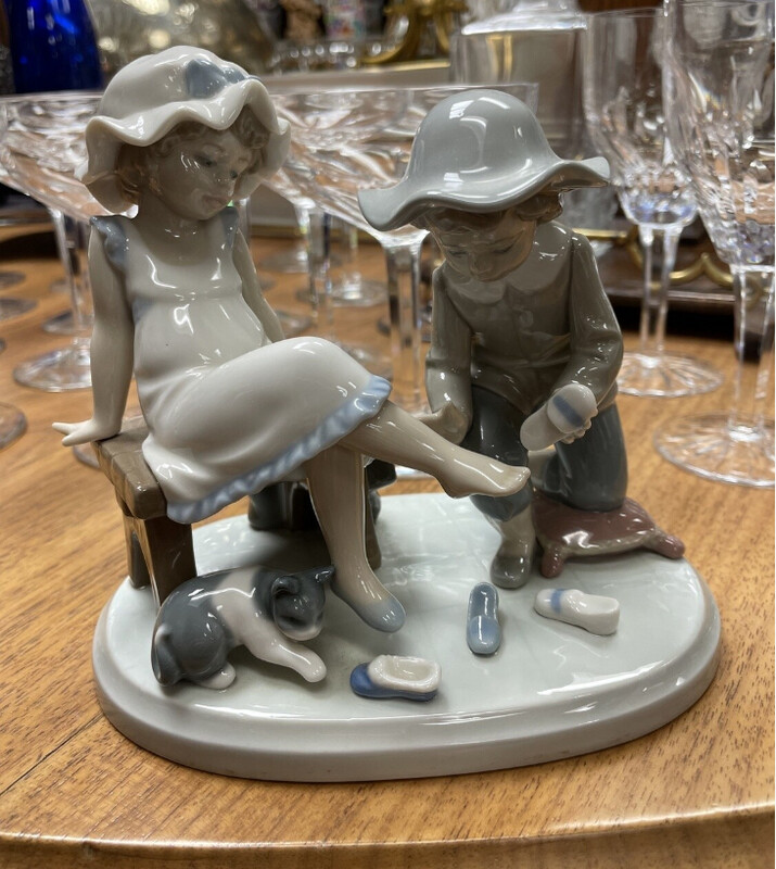 Porcelain Figure of a boy girl and cat