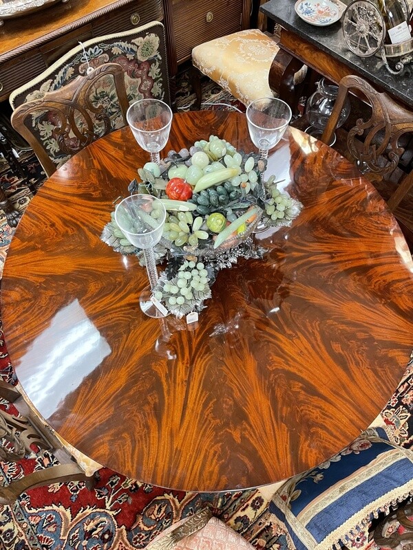 William IV Round Center Table with Bookmatched Crotch-Grain Mahogany, 53&#39; wide by 30&#39; high. Raised on Column with Trifid Base with Scroll Feet. England, circa 1832