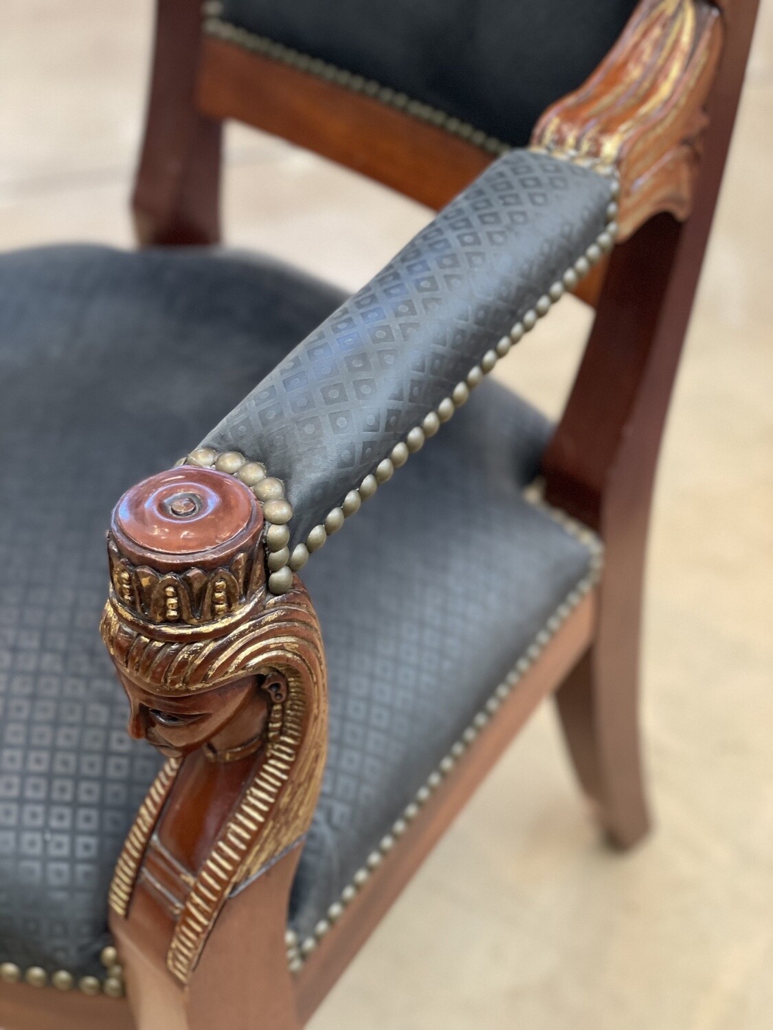 French Mahogany Empire Style Arm Chair with Brass Nailhead Trim, Egyptian Gilt Carved Figural busts in Chair Arms and Paw Feet and Black Upholstry