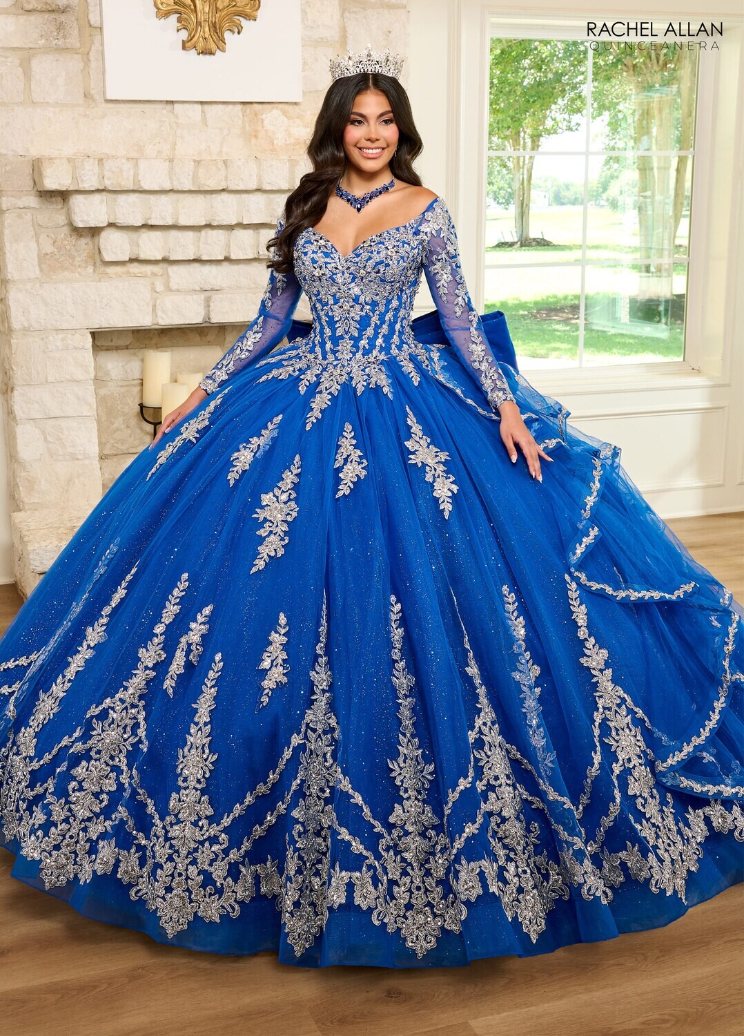 RQ1137 Fabric: 	TULLE, GLITTER TULLE, APPLIQUE, BEADING Available In: 	EMERALD GOLD, ROYAL SILVER