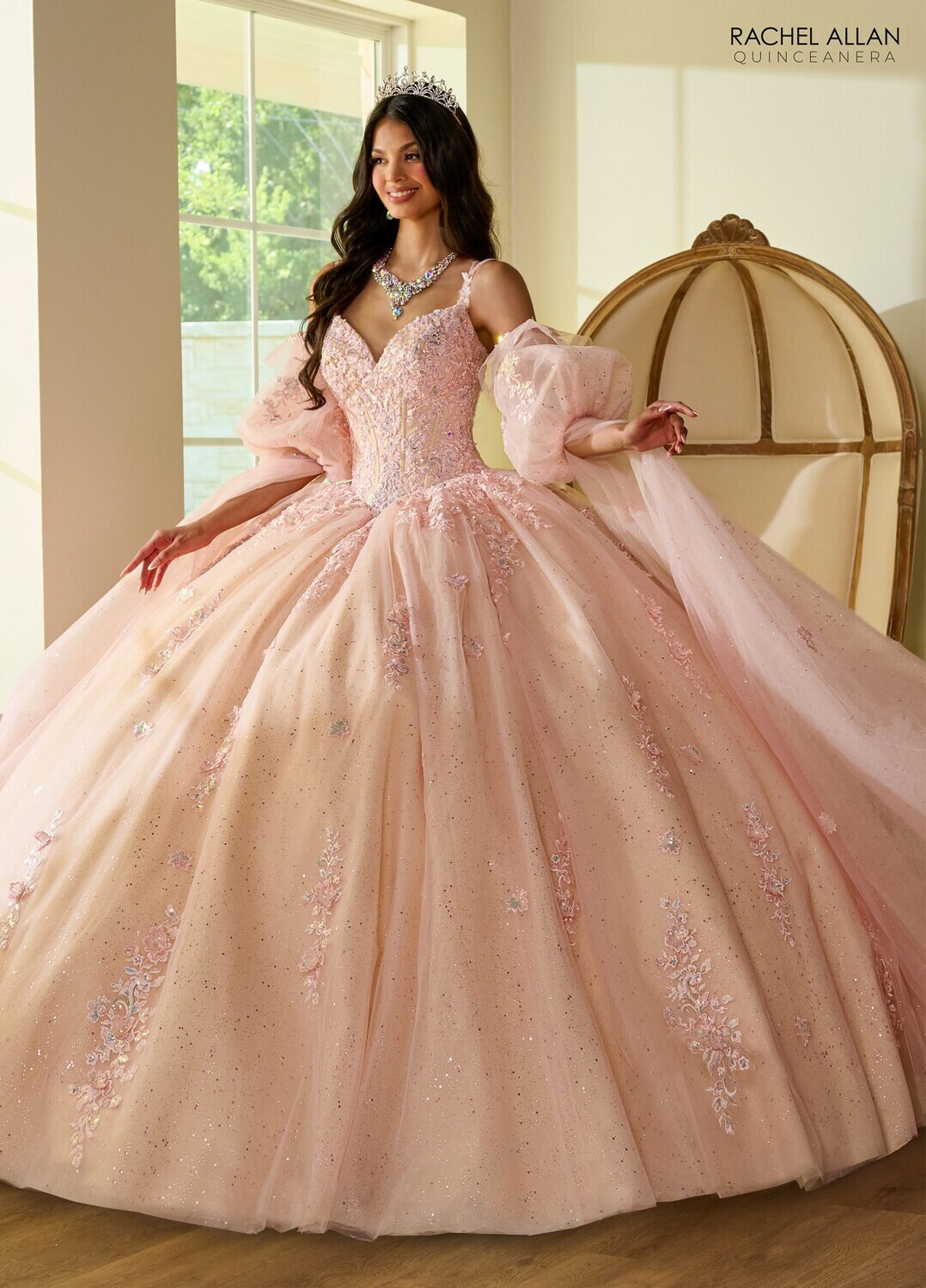 RQ1133 Fabric: 	TULLE, GLITTER TULLE, APPLIQUE, BEADING Available In: 	BLUSH CHAMPAGNE, LIGHT BLUE CHAMPAGNE