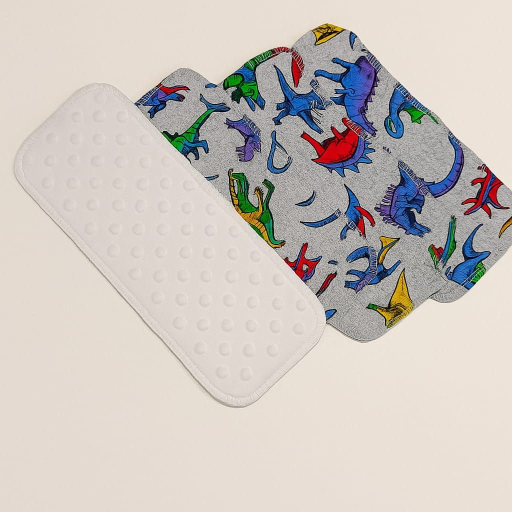 liner de tela con diseño de dinosaurios