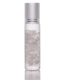 Photo of a Love Roll On Oil bottle, featuring an organic blend for mood elevation and self love. The bottle is clear with a roll-on applicator at the top, filled with a light-colored liquid. The label highlights its use for enhancing positivity and connection.