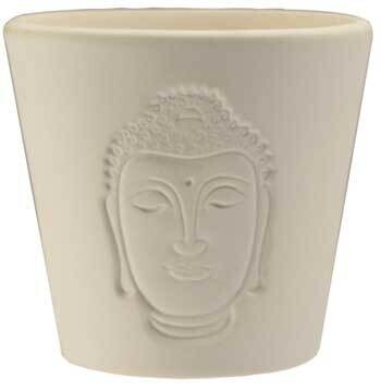 Photo of a ceramic votive holder with a Buddha shadow design, adding a serene touch to home décor. Ideal for votive candles, enhancing elegance and tranquility in any room.