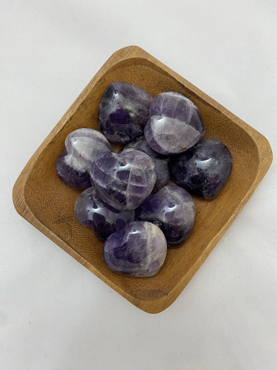 1.25&quot; Amethyst Heart with a vibrant purple color, designed to support healing, intuition, and psychic abilities. Each heart is unique in color and shape. Disclaimer: Stone color, size, or shape may slightly vary from image. Each order is randomly chosen by The Crystal Shrine staff.