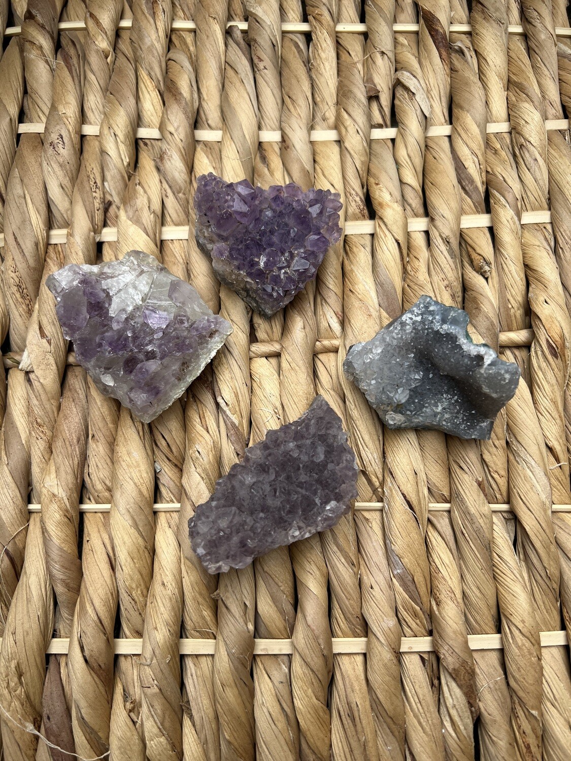 Photo of Small Amethyst Druzy Raw with a natural, sparkling texture, perfect for gem and crystal collectors. Ideal for adding a unique touch to any collection. Disclaimer: Stone color, size, or shape may slightly vary from image. Each order is randomly chosen by The Crystal Shrine staff.