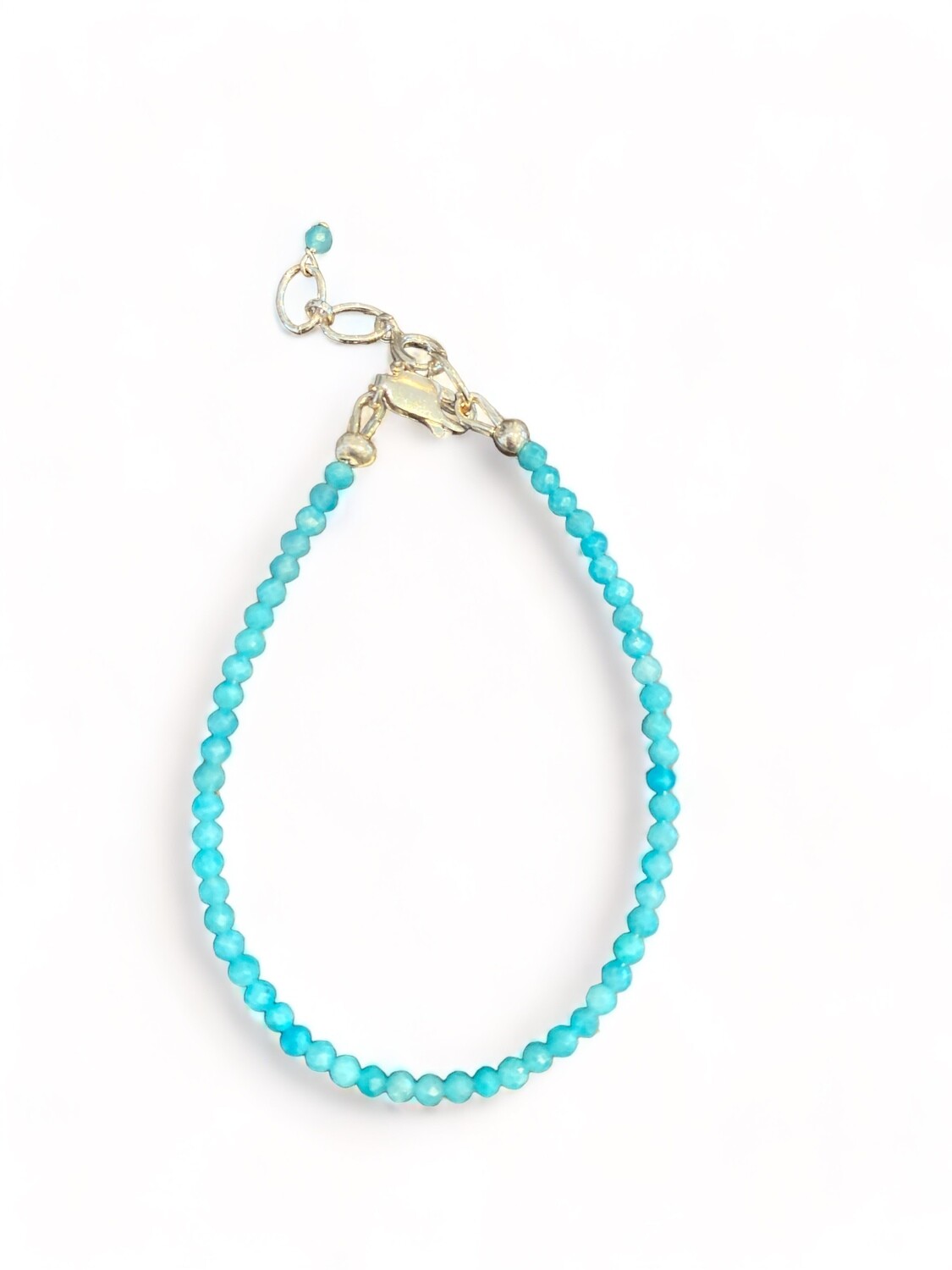 Photo of a 2mm Amazonite micro-faceted bracelet with a sterling silver clasp and extender. This elegant 6.5-inch piece helps to boost courage and communication.