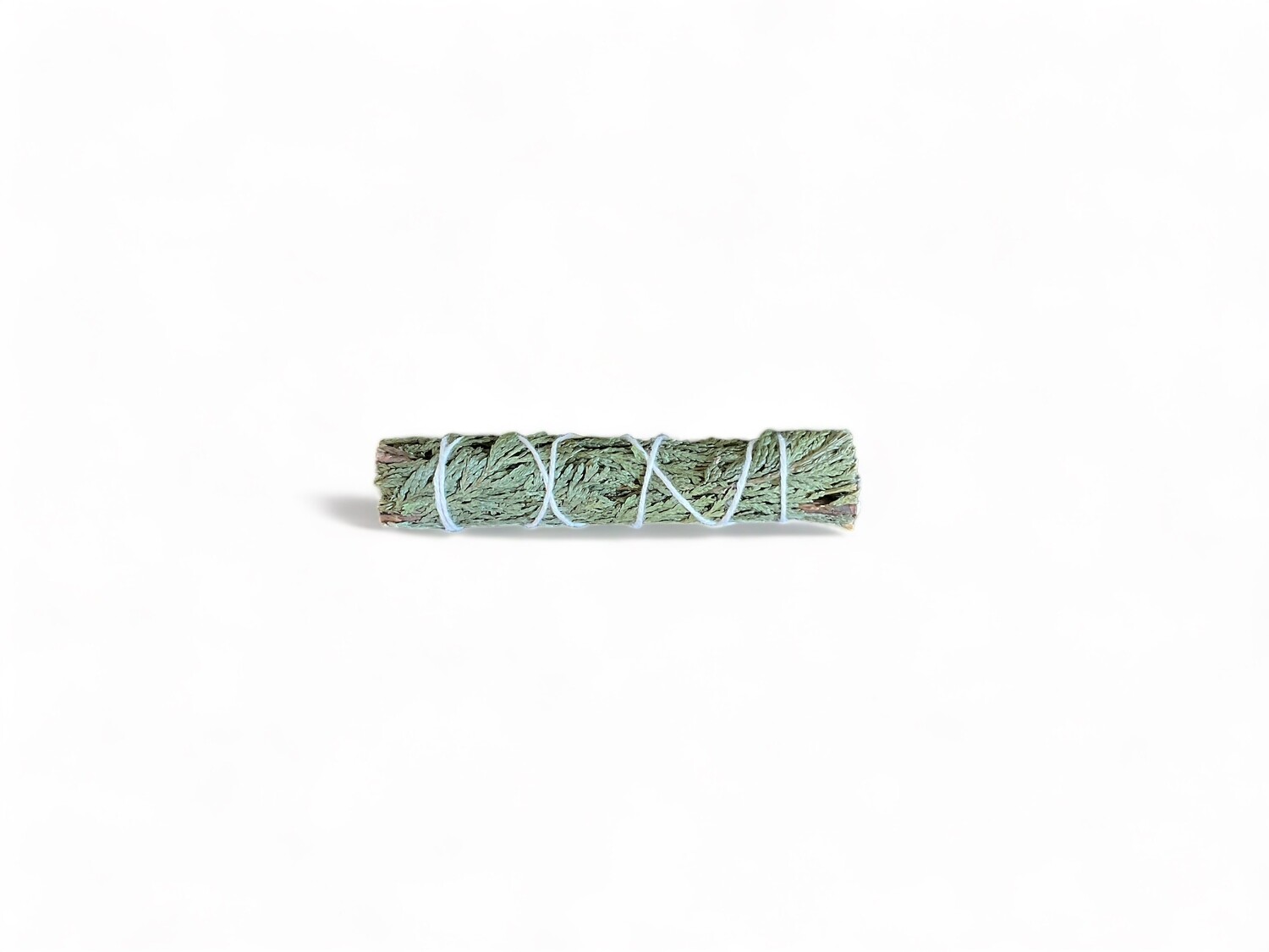 Cedar Slim Sage Four Inch Bundle - A slender bundle of cedar sticks, bound together with natural twine. The sage has a rich brown color and a distinct, earthy aroma. This bundle is used in spiritual practices for purification, protection, healing, and attracting wealth. It is ideal for use in rituals and ceremonies to enhance spiritual and emotional well-being.