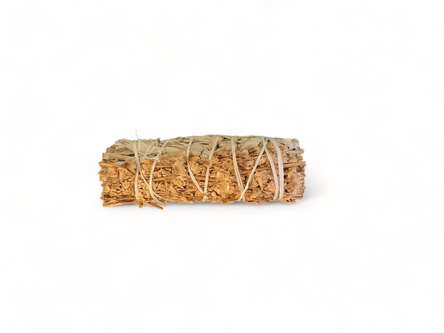 Image of a four inch bundle of white sage and lemon basil. The white sage is wrapped with lemon basil, designed to enhance abundance, joy, and positive energy. Ideal for spiritual and healing practices.