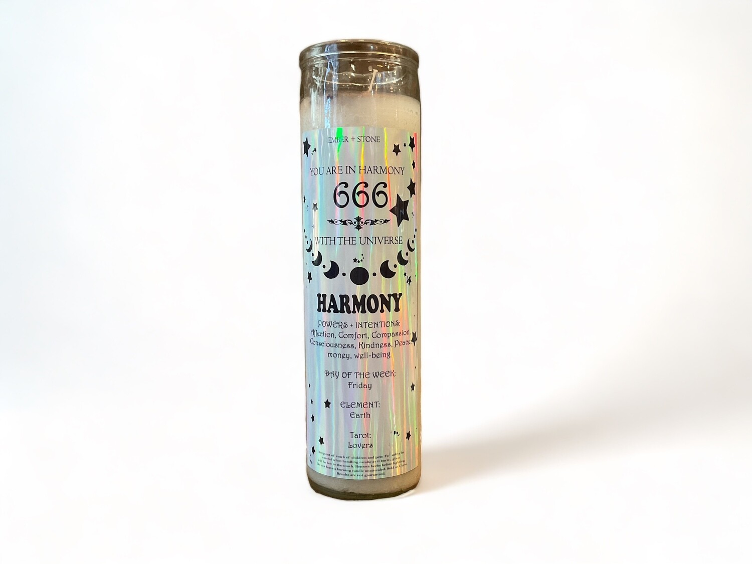 Image of a glass jar candle labeled &#39;Angel Number 666&#39;, emitting a serene glow. This intention candle is designed to promote harmony and balance, infusing your environment with soothing energy and peaceful vibes.