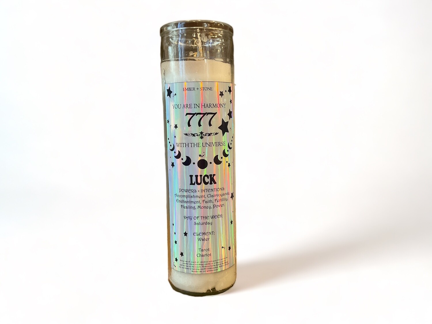 Image of a glass jar candle labeled &#39;Angel Number 777&#39;, glowing softly. This intention candle is crafted to attract luck and good fortune, infusing your space with positive energy and prosperity.