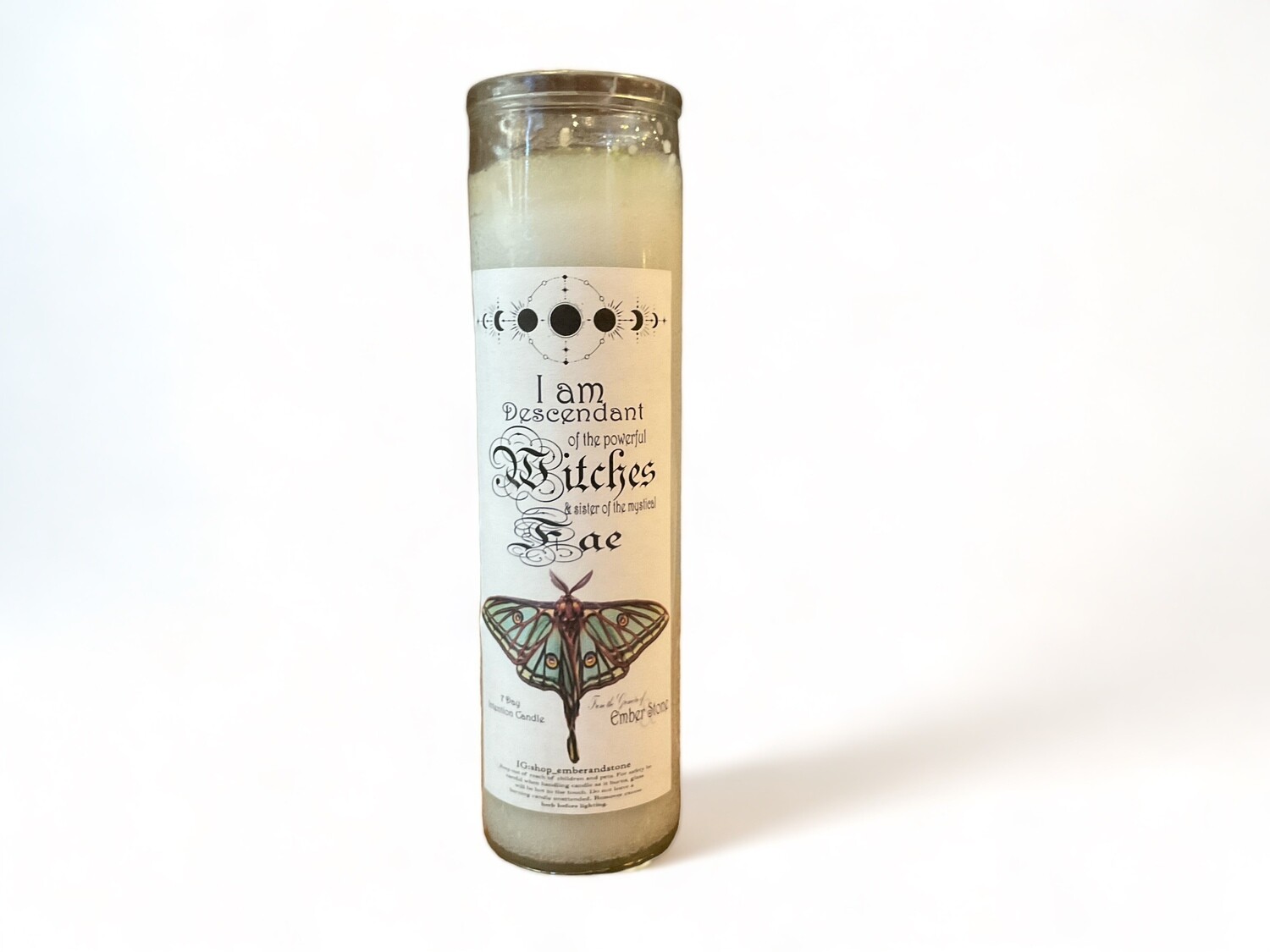 Image of a skinny glass jar candle labeled &quot;Witch &amp; Fae,&quot; designed for setting intentions and adding a magical touch. Ideal for enhancing rituals and creating ambiance.