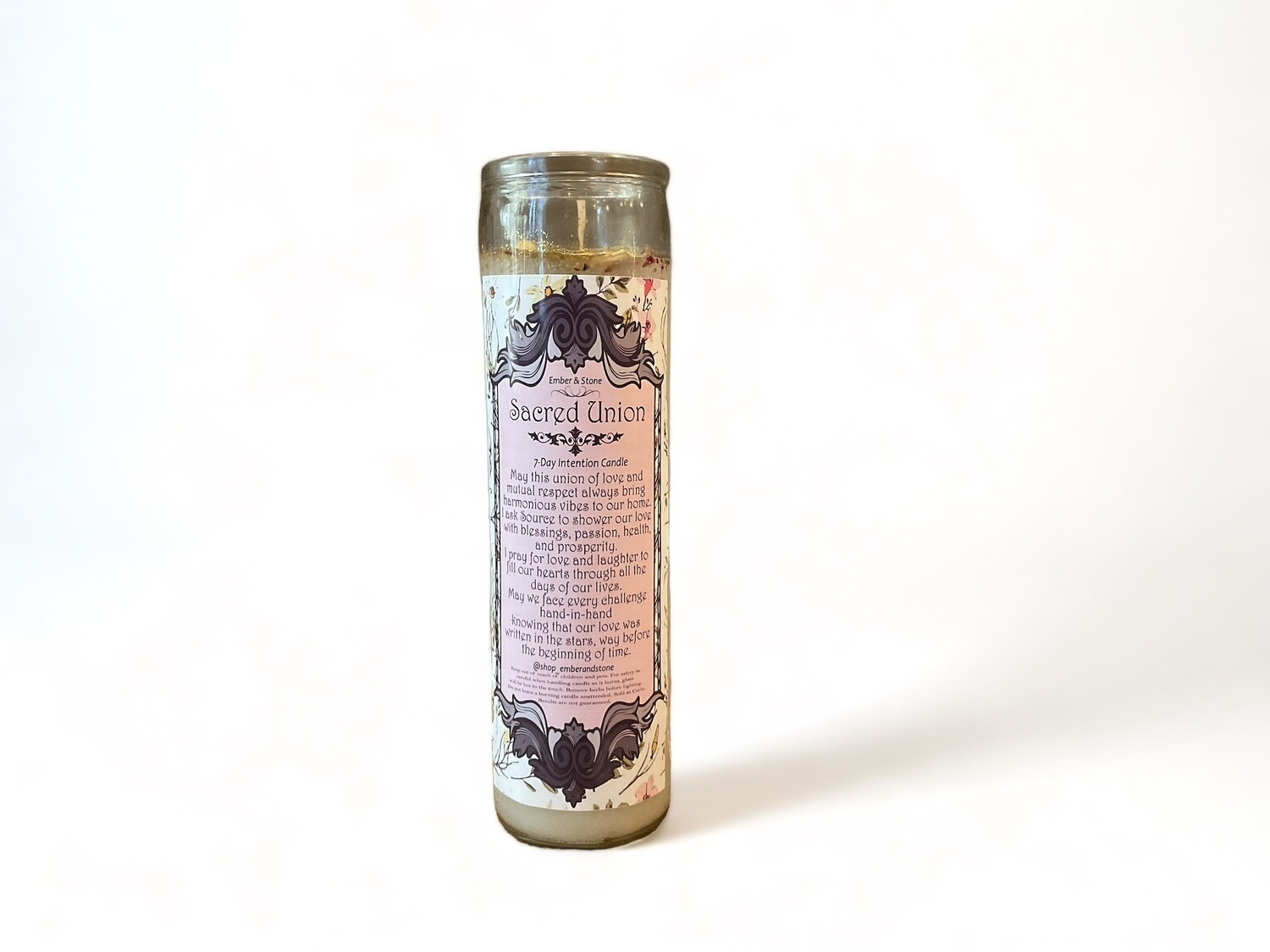 A sleek skinny glass jar containing the Sacred Union Candle, perfect for celebrating unity and enhancing connections. An ideal gift for couples seeking harmony.