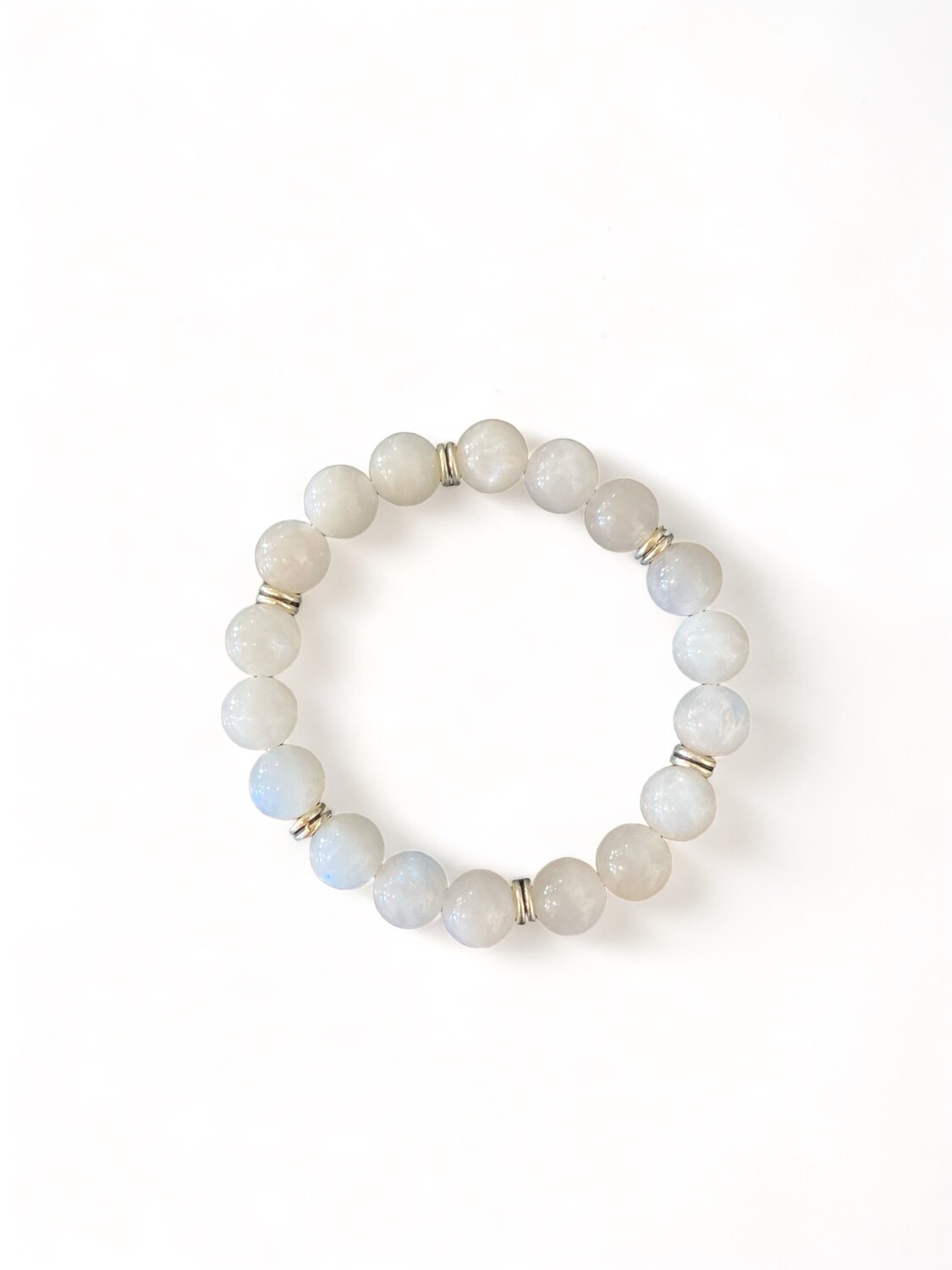 Image of a 10mm Rainbow Moonstone crystal bead bracelet showing its iridescent play of colors. The beads feature hues of blue, white, and silver, aiding intuition and emotional balance.