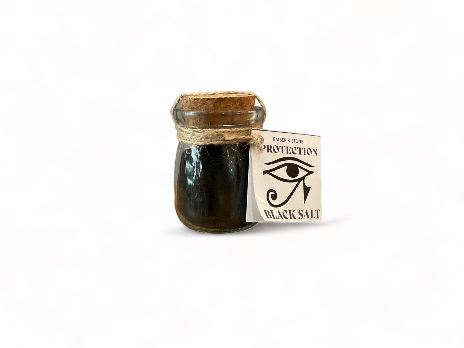 Photo of a Black Salt Herb Blend - A dark, coarse salt blend in a clear container, used for spiritual protection and removing negativity. The salt has a deep black color, symbolizing its protective and purifying properties, making it suitable for enhancing spiritual practices.