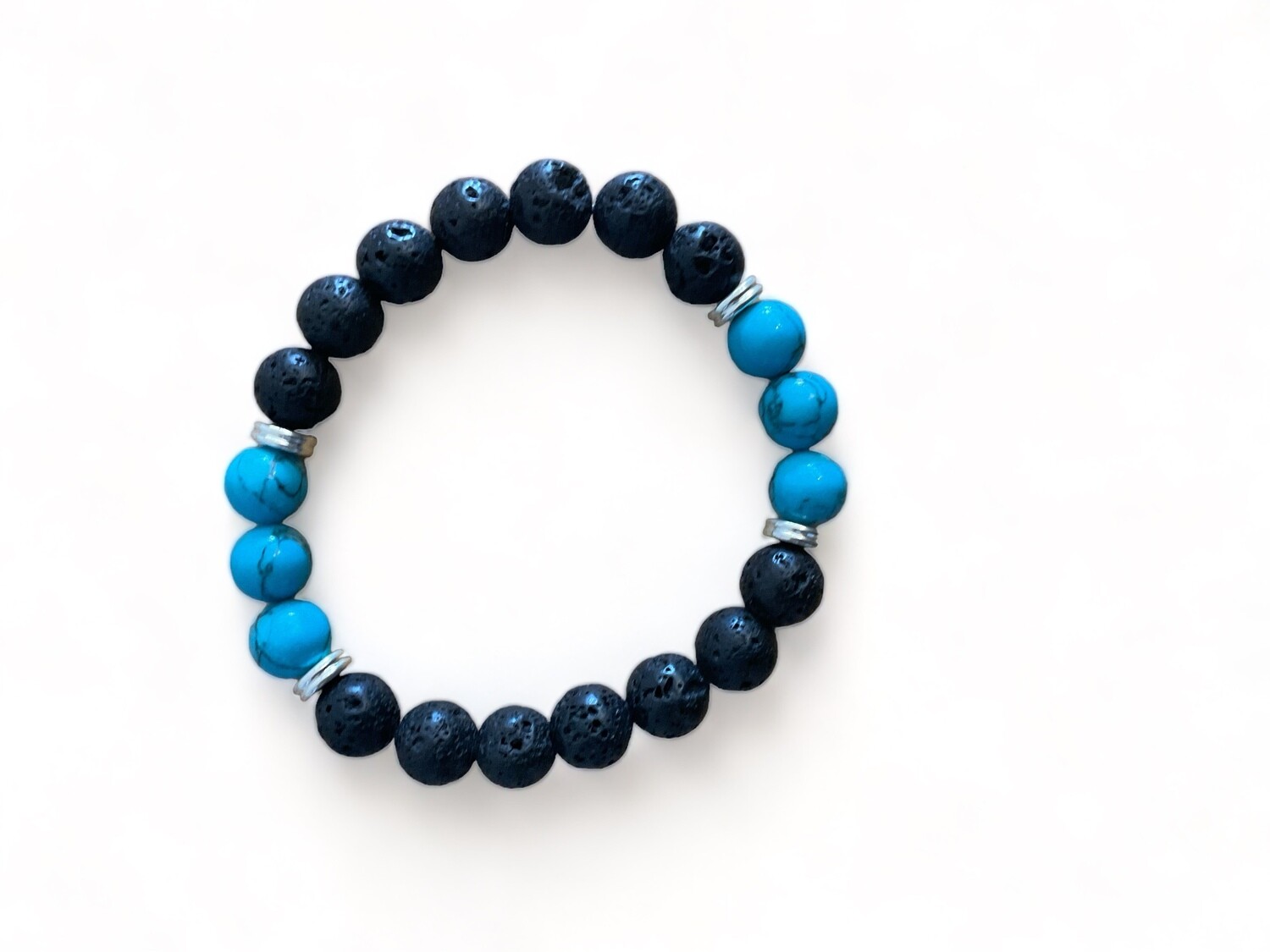 A photo of a 10mm bracelet featuring black matte agate and turquoise howlite crystal beads. The bracelet is designed to enhance protection and emotional awareness.