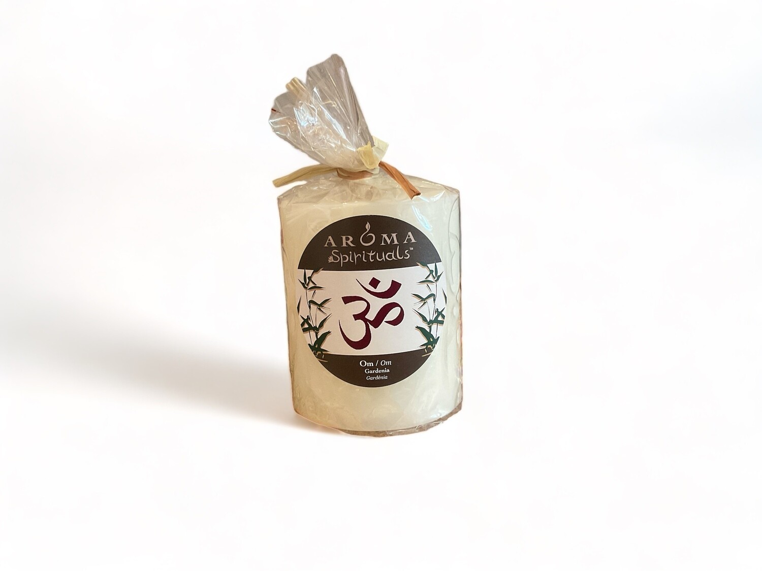 Image of the Aroma Spirituals 3x3.5 Candle Om, offering tranquility with Gardenia fragrance. Crafted from food-grade ingredients and vegetable waxes, this pillar candle includes a lead-free wick and provides up to 60 hours of burn time.