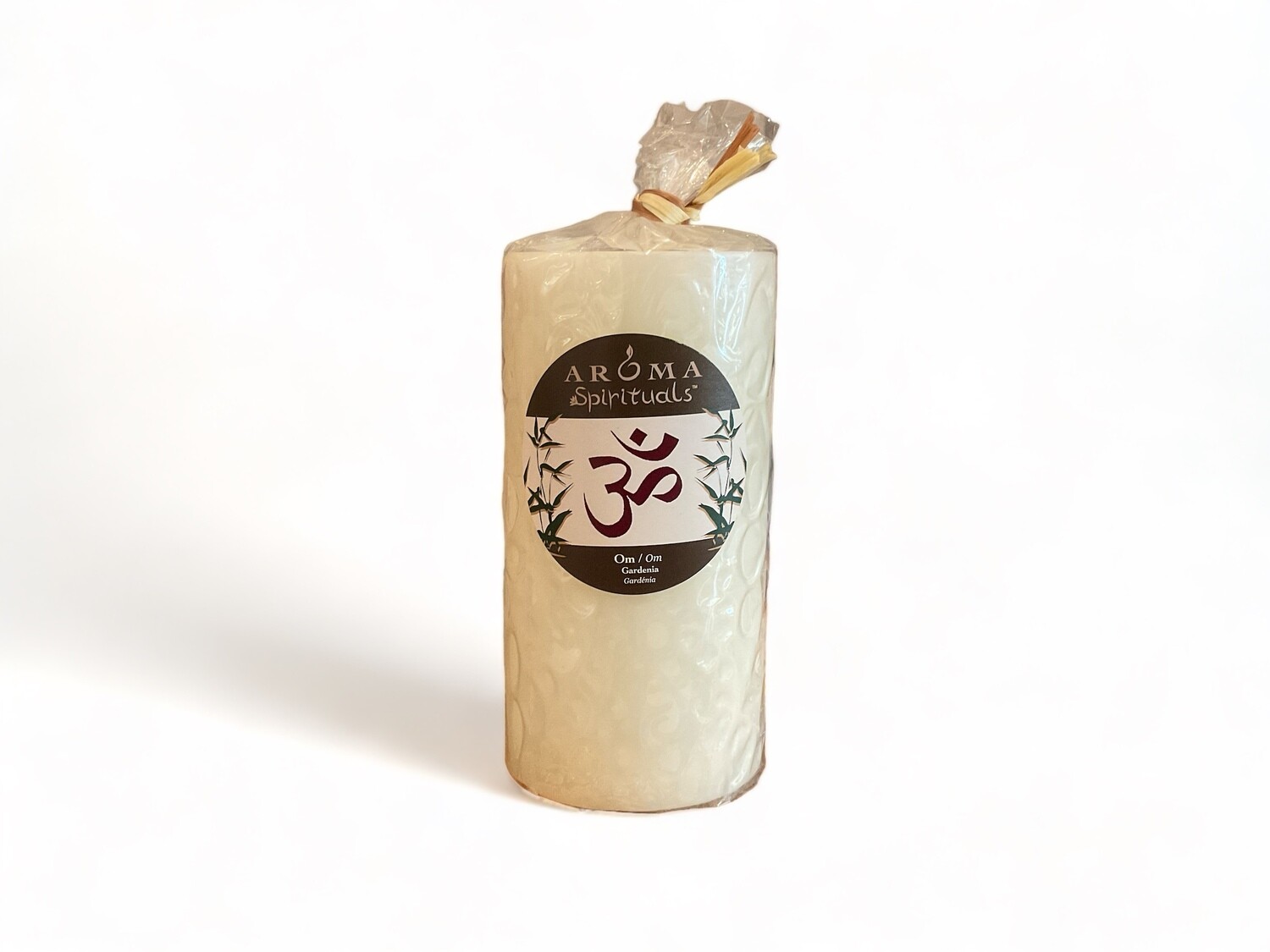 Image of the Aroma Spirituals 3x6 Candle Om infused with Gardenia fragrance, offering a serene and calming ambiance. Crafted from food-grade ingredients and vegetable waxes, featuring a lead-free wick and providing up to 100 hours of burn time.
