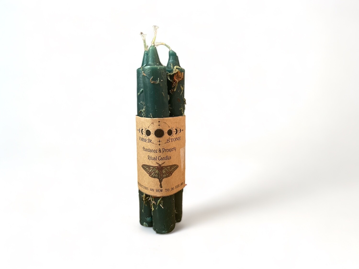 Image of a Ritual Candle Bundle featuring three pre-dressed green taper candles. Designed to enhance abundance and prosperity, complete with easy-to-follow use instructions.
