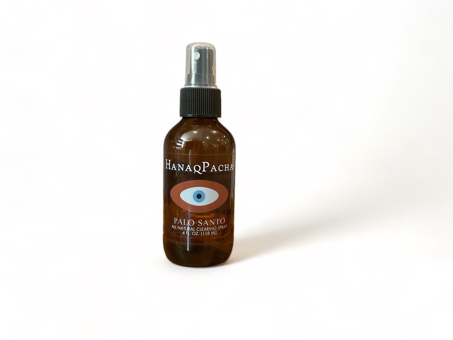 Image of a bottle of Palo Santo Spray four fluid ounces. The image shows a clear glass spray bottle with a pump nozzle. The label includes the product&#39;s purpose as an all-natural clearing spray for purifying spaces and enhancing positivity. The bottle&#39;s sleek design features a simple, clean aesthetic, emphasizing its use for energy cleansing and spiritual rituals.