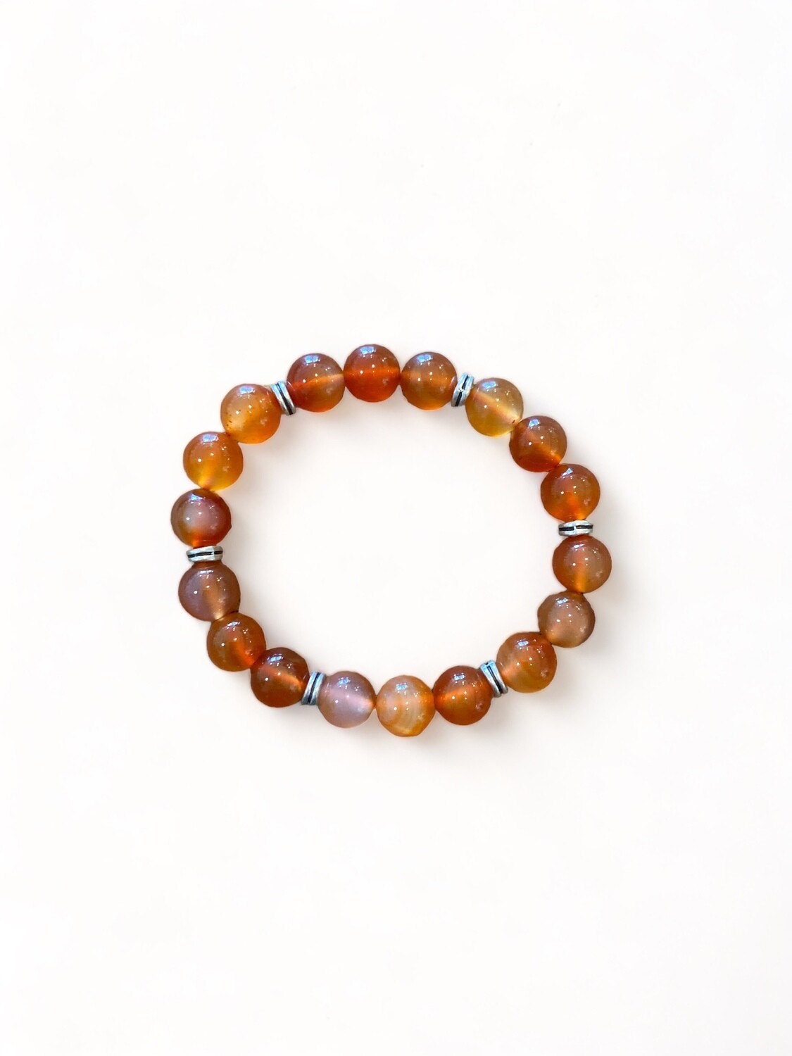 Image of a 10mm Carnelian bead bracelet featuring vibrant orange stones. Enhances creativity, courage, and inspiration, perfect for boosting personal power and generating ideas.