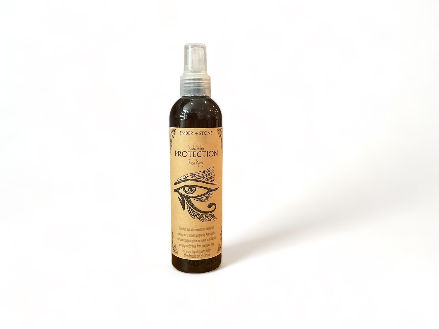 Image of a bottle of Protection Room Spray. The bottle features a label that reads &#39;Protection&#39; and describes the product as an energy shielding mist made from a blend of roots and resins. The label highlights its purpose for spiritual and physical protection. The design emphasizes its use for shielding and protection in both personal and sacred spaces.