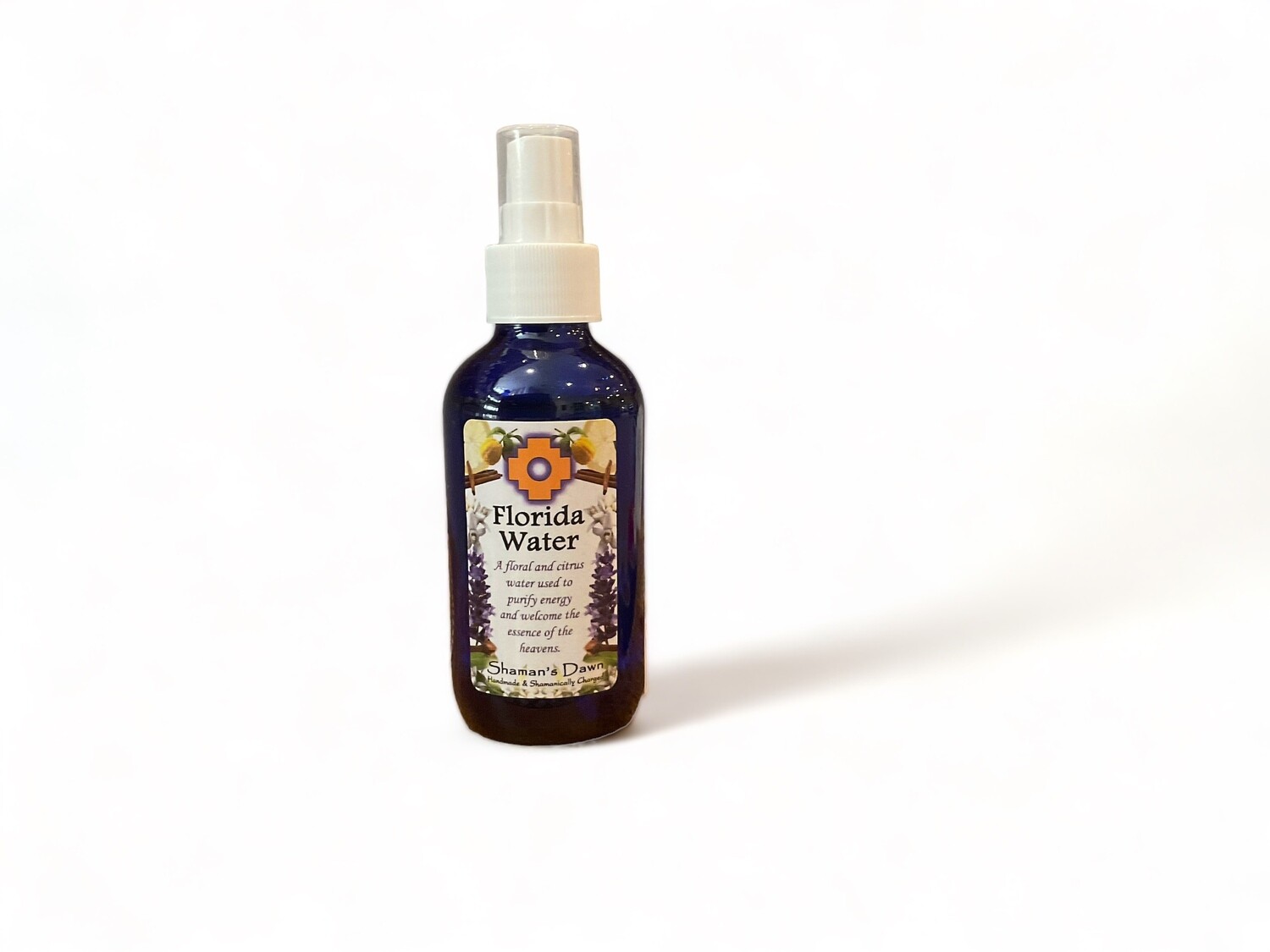 Image of a bottle of Florida Water Spray. The two ounce bottle features a label with the text &#39;Florida Water Spray&#39;. The label highlights its purpose for purifying energy and inviting divine essence, with ingredients including citrus and floral oils. The design reflects its use for spiritual and energetic clarity.