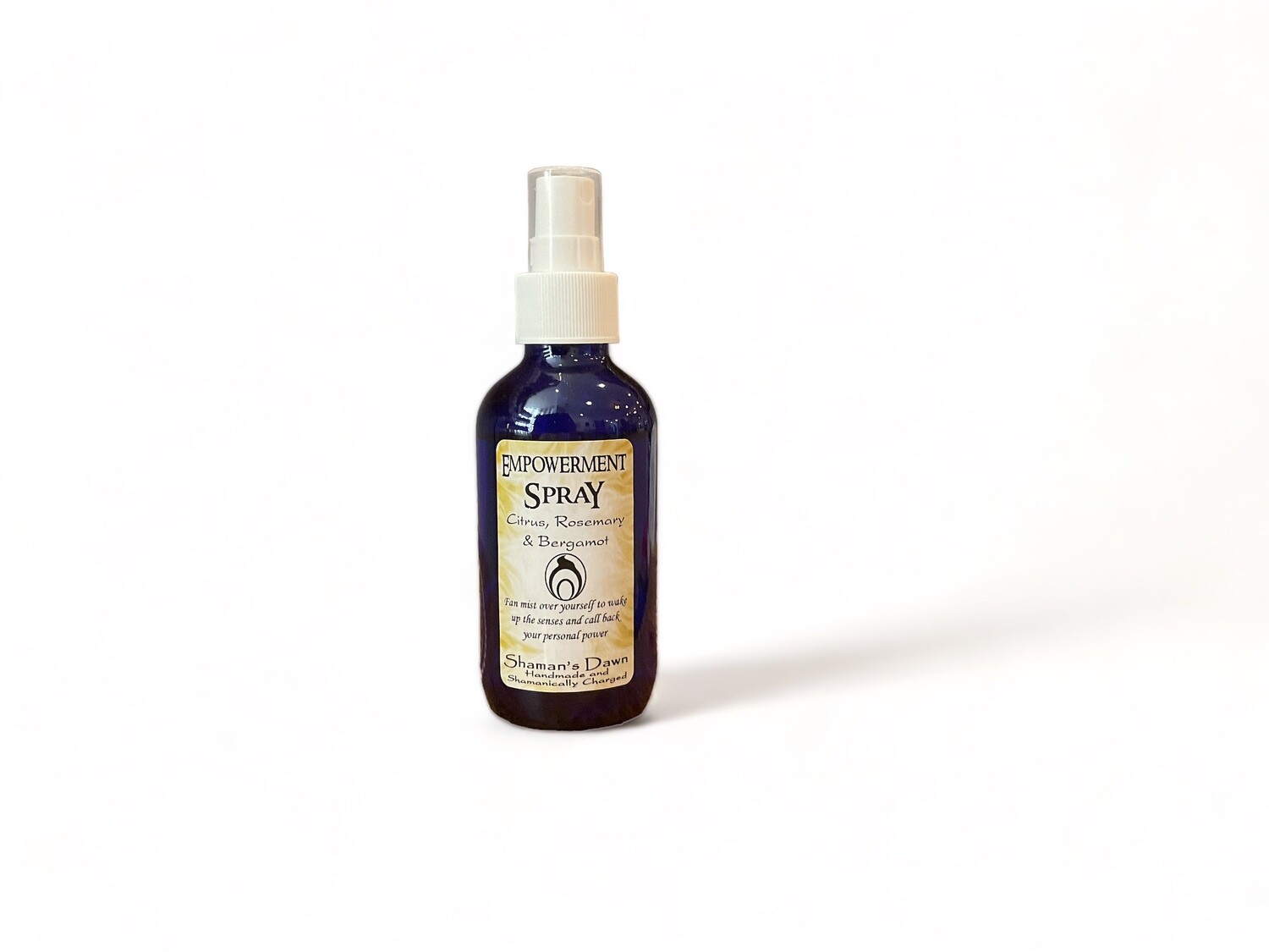 Image of a two ounce bottle of Empowerment Spray. The label includes details about its use for revitalizing senses and reclaiming personal power, with essential oils of citrus, rosemary, and bergamot. The design emphasizes the spray&#39;s metaphysical qualities and empowering effects.