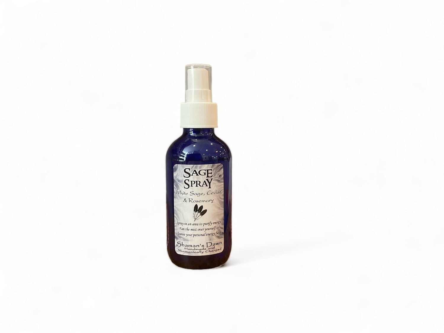 Image of a bottle of Sage Spray. The bottle is clear with a label that reads &#39;Sage Spray&#39; and details the use of White Sage, Cedar, and Rosemary essential oils. The label describes the spray as a purifying mist designed to cleanse and refresh spaces and personal energy fields. It emphasizes the product&#39;s ability to bring spiritual clarity and purify energy.