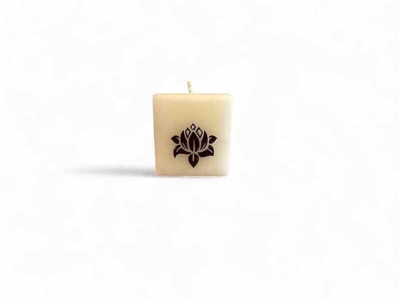 Image of the Purity Cube Votive Candle, fragranced with Gardenia, Lotus &amp; Jasmine. Crafted from food-grade ingredients and vegetable waxes, featuring a lead-free wick and offering 20 hours of burn time.