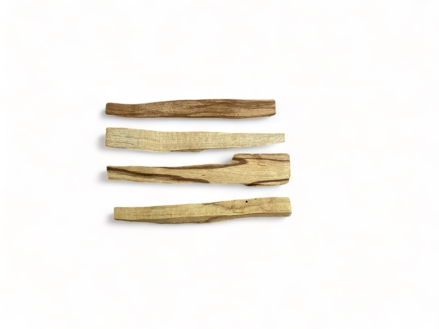Image of a Premium Palo Santo four Pack. The image displays four sticks of Palo Santo. The sticks are light brown with a smooth texture and natural wood grain. Palo Santo, often called &#39;holy wood,&#39; is revered for its use in energy clearing and attracting positive energy. 