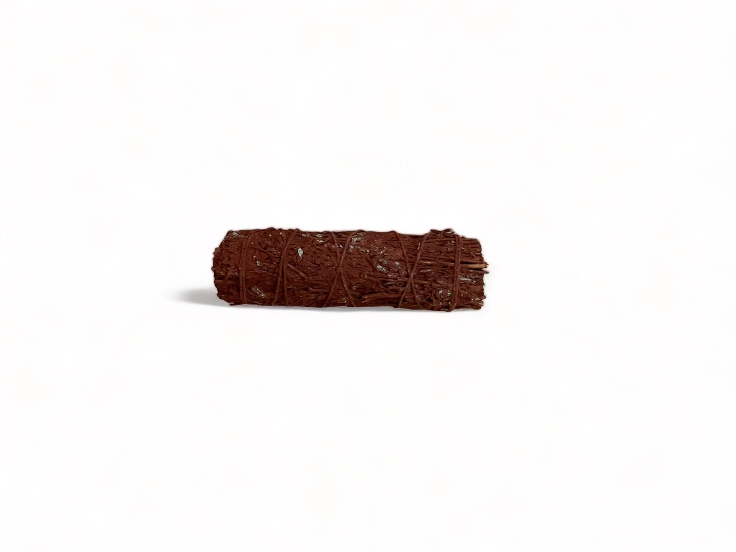 Photo of a bundle of Dragon&#39;s Blood Blue Sage. A  three inch bundle of blue sage sticks infused with Dragon&#39;s Blood resin. The bundle is tied with natural twine and has a rich, earthy scent. It features deep red hues from the Dragon&#39;s Blood resin. This sage is used in rituals for effective cleansing, purification, abundance, and protection.
