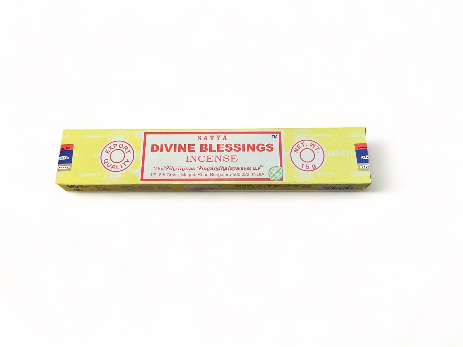 Image of a box of Satya Divine Blessings incense sticks. The sticks are hand-rolled in India and have a deep, rich color. The box is compact and features a label indicating the incense&#39;s high-quality ingredients, including pure extracts and fine oils. The incense offers a sweet, long-lasting earthy fragrance, designed to persist even after burning. The packaging is designed for easy handling and storage, reflecting the premium nature of the incense. Fifteen sticks come in one box. 